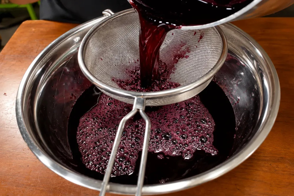 Step 3: Straining & Chilling the Ruby Concentrate